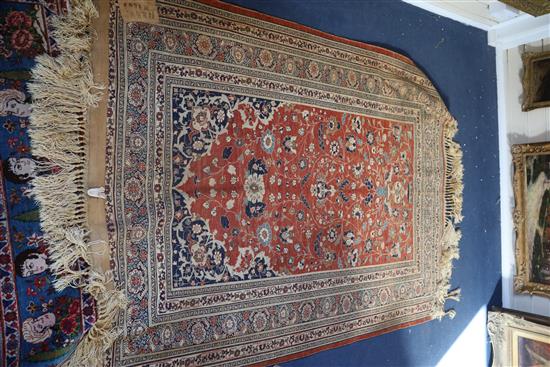 A Tabriz silk rug, 5ft 9in by 4ft 6in.